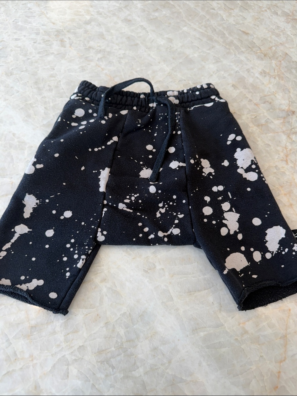 nununu Black Shorts with White Paint-Splash Print
